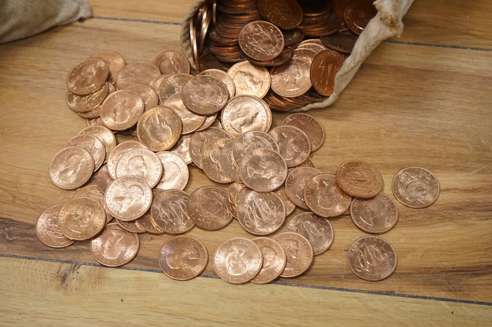 A bag of 1966 pennies and another with half pennies (UNC)